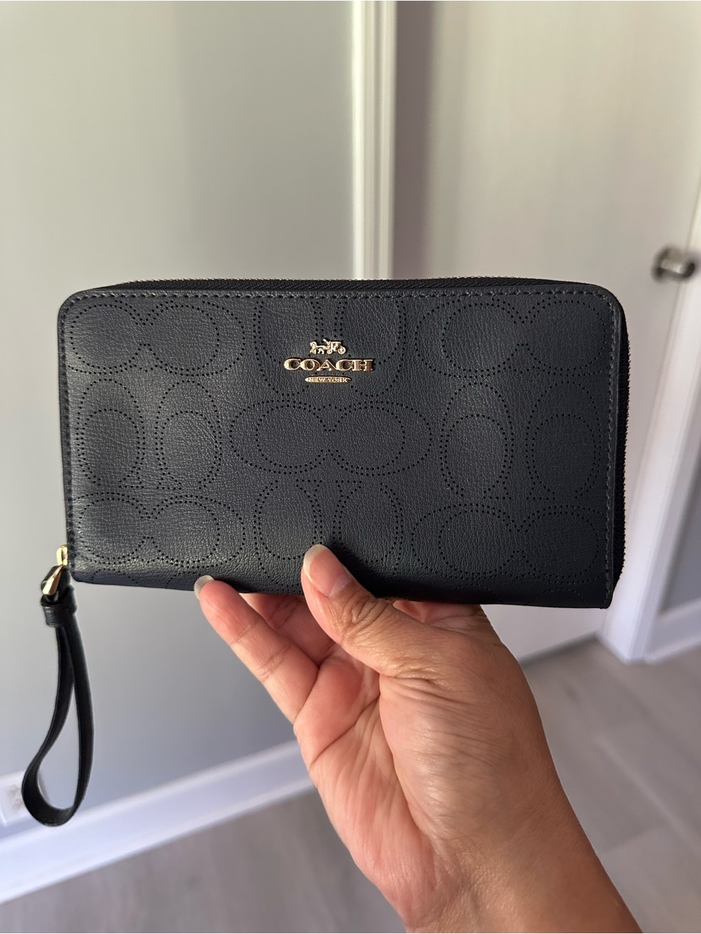 Coach Large Wallet in signature perforated leather